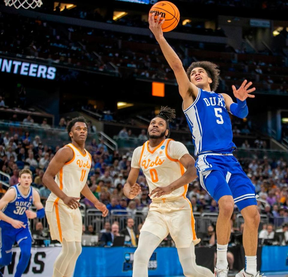 Duke’s Tyrese Proctor (5) drives to the basket against Tennessee’s Jonas Aidoo (0) during the second half in the second round of the NCAA Tournament on Saturday, March 18, 2023 at the Amway Center in Orlando, Fla. Proctor lead Duke with 16 points in their 65-52 loss. Robert Willett/rwillett@newsobserver.com