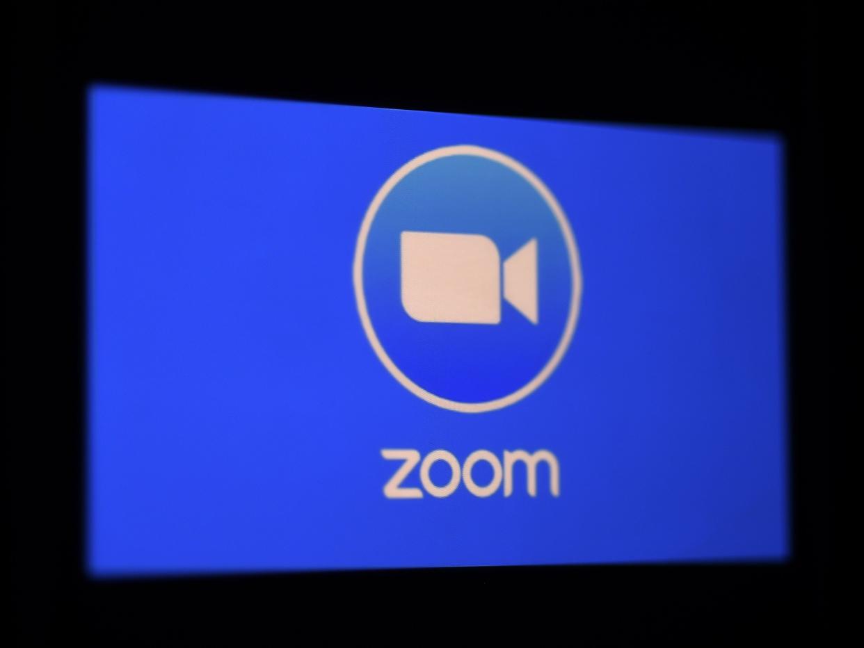 In this photo illustration a Zoom App logo is displayed on a smartphone on 30 March 2020 in Arlington, Virginia (AFP via Getty Images)