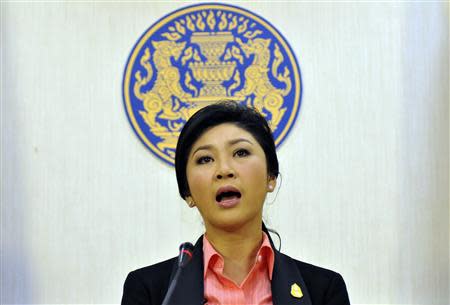 Thai Prime Minister Yingluck Shinawatra talks during a news conference at police headquarters in Bangkok December 9, 2013. REUTERS/Stringer