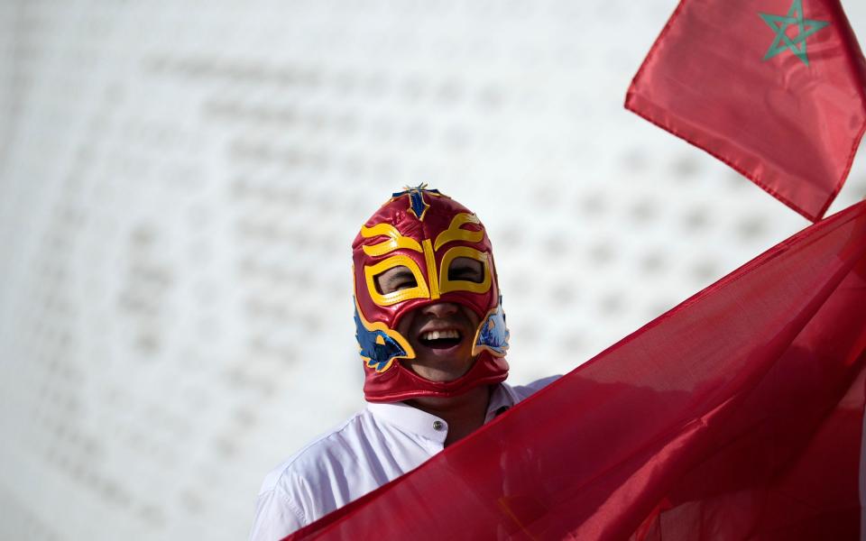 A supporter of Morocco poses prior to the World Cup group F soccer match between Belgium and Morocco, at the Al Thumama Stadium in Doha - AP