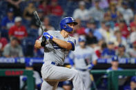 Los Angeles Dodgers' Corey Seager follows through after hitting a double off Philadelphia Phillies starting pitcher Matt Moore during the sixth inning of a baseball game, Tuesday, Aug. 10, 2021, in Philadelphia. (AP Photo/Matt Slocum)