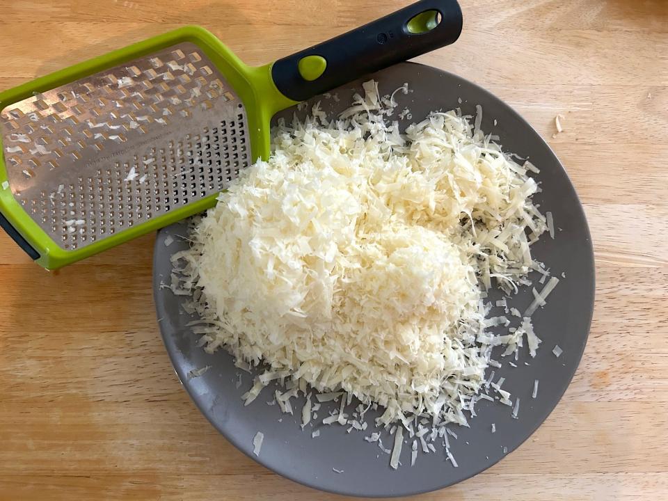 Grating cheese for Ina Garten's "Grown Up" Mac and Cheese