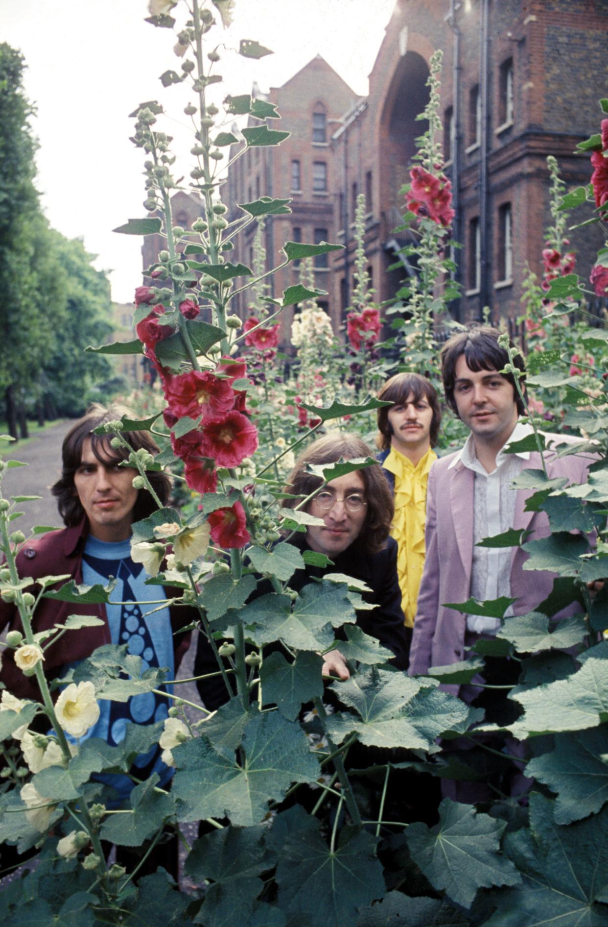 The Beatles during a photo session, St Pancras Old Church gardens, London, 28 July 1968.