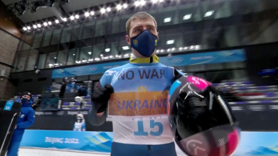 2022 Beijing Olympics - Skeleton - National Sliding Centre, Yanqing District, Beijing, China - February 11, 2022. Vladyslav Heraskevych of Ukraine holds a sign with a message reading 'No war in Ukraine'. IOC/OBS/Handout via Reuters