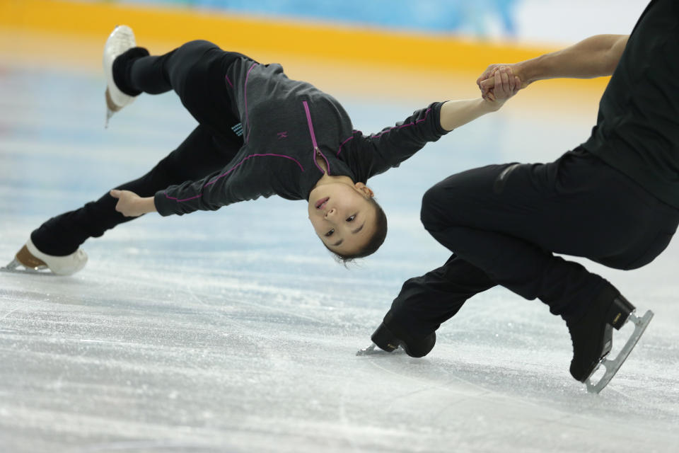 Narumi Takahashi and Ryuichi Kihara of Japan practice at the figure skating practice rink ahead of the 2014 Winter Olympics, Tuesday, Feb. 4, 2014, in Sochi, Russia. (AP Photo/Ivan Sekretarev)