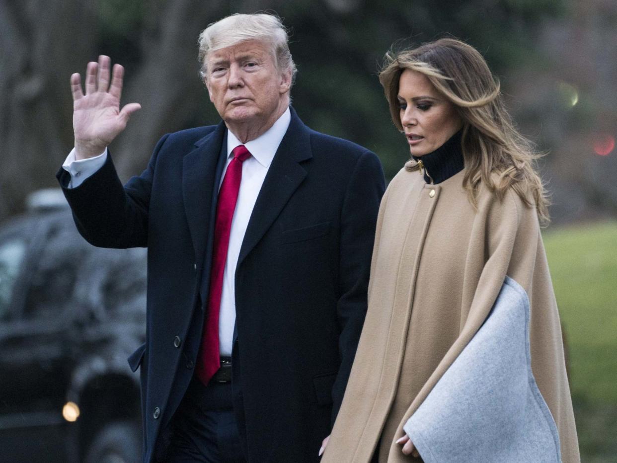 US president Donald Trump and first lady Melania Trump walk along the South Lawn to Marine One as they depart from the White House: Sarah Silbiger/Getty