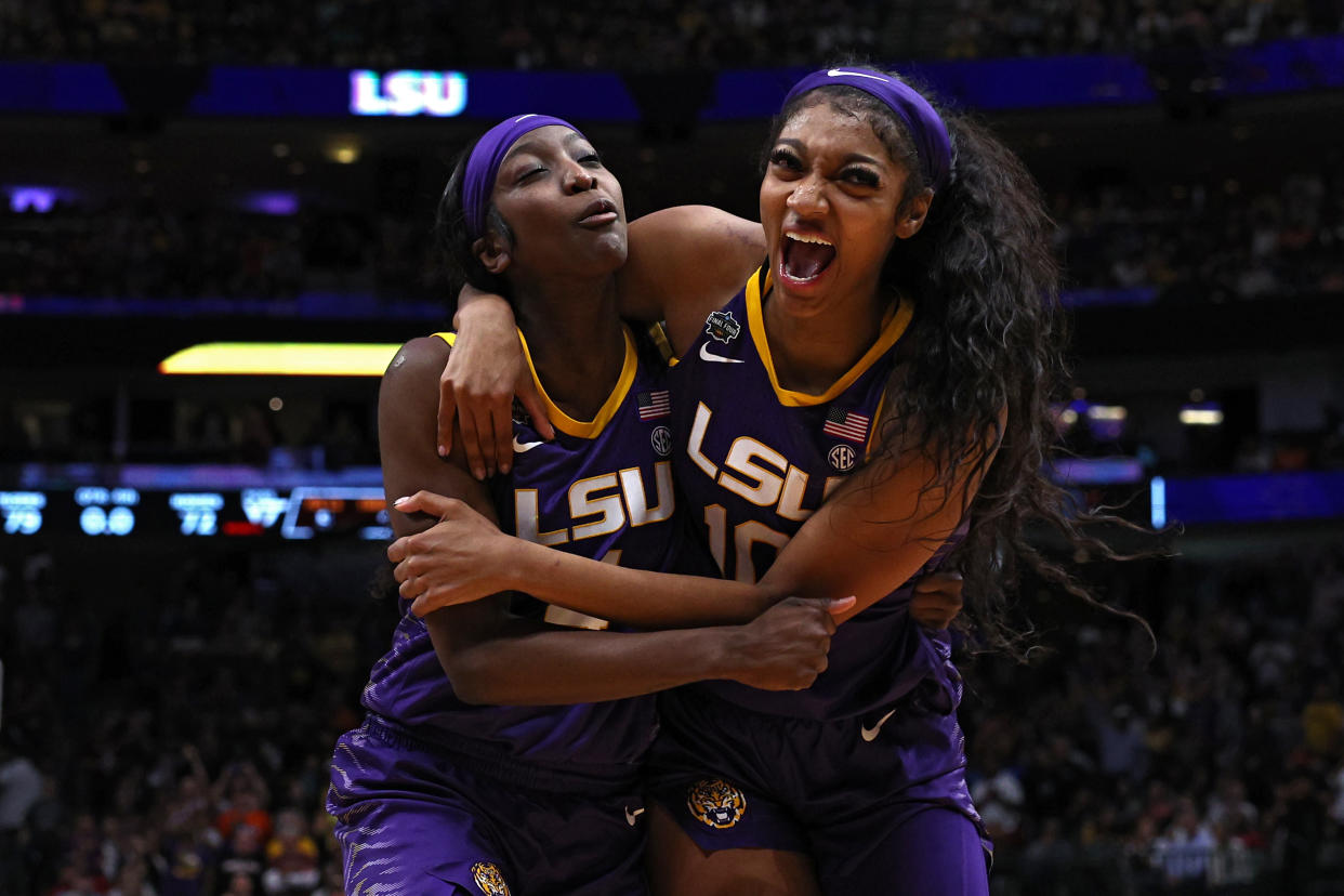LSU's Flau'jae Johnson and Angel Reese celebrate after winning a Final Four game last season. Can LSU become back-to-back champions this season after another summer of high-profile transfers? (Photo by Tom Pennington/Getty Images)