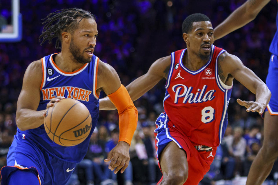 New York Knicks' Jalen Brunson, left, drives to the basket against Philadelphia 76ers' De'Anthony Melton, right, during the first half of an NBA basketball game Friday, Nov. 4, 2022, in Philadelphia. (AP Photo/Chris Szagola)