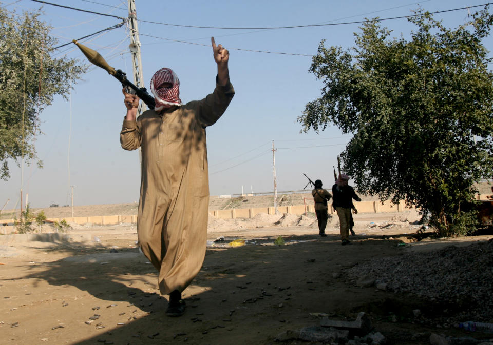 Gunmen patrol in Fallujah, 40 miles (65 kilometers) west of Baghdad, Iraq, Thursday, Jan. 9, 2014. Tribal leaders in Fallujah have warned al-Qaida fighters there to leave to avoid a military showdown, and there were signs that residents of Fallujah were trying to restore a sense of normalcy, however precarious.(AP Photo)