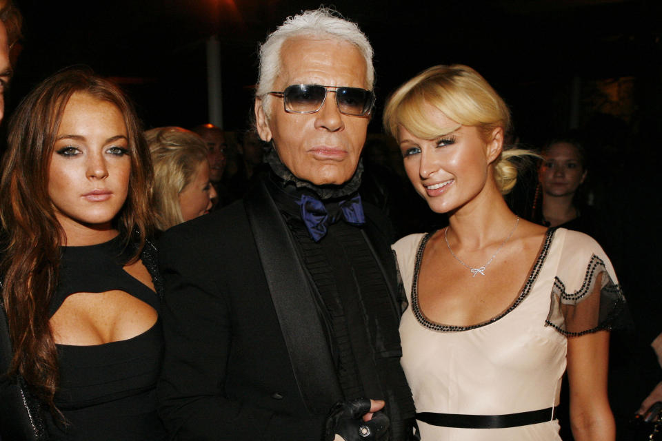 Co-host designer Karl Lagerfeld with actresses Paris Hilton (R), and Lindsay Lohan (L) at the private party for the new campaign of Dom Pérignon Rosé Vintage 1996 by Karl Lagerfeld held at a Beverly Hills residence. (Photo by Stephane Cardinale/Corbis via Getty Images)