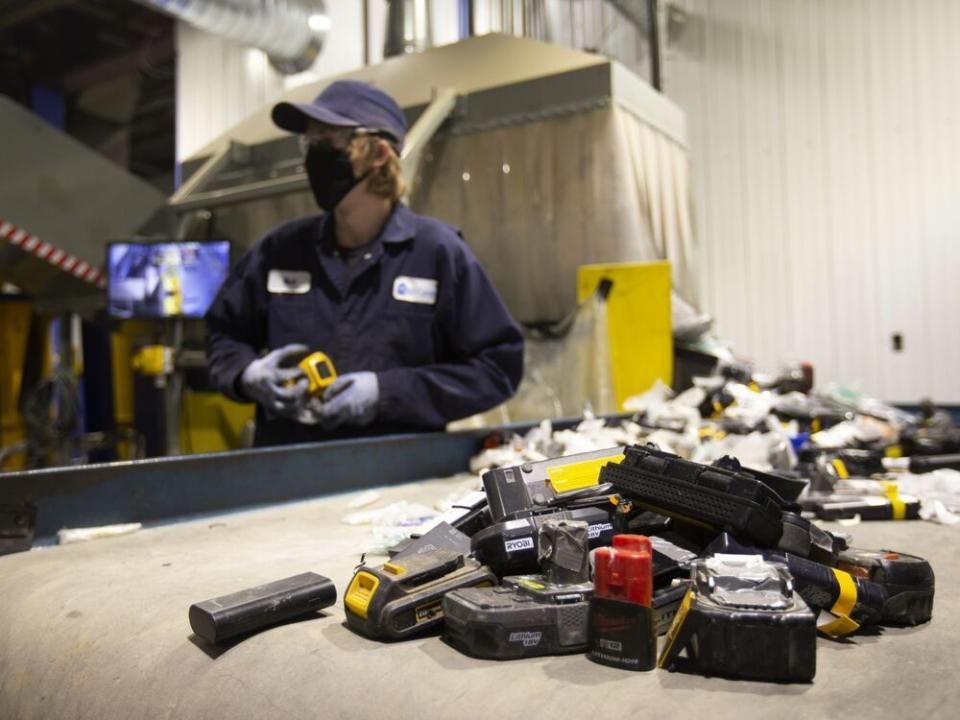  A worker sorts batteries at the Li-Cycle lithium-ion battery recycling facility in Kingston.