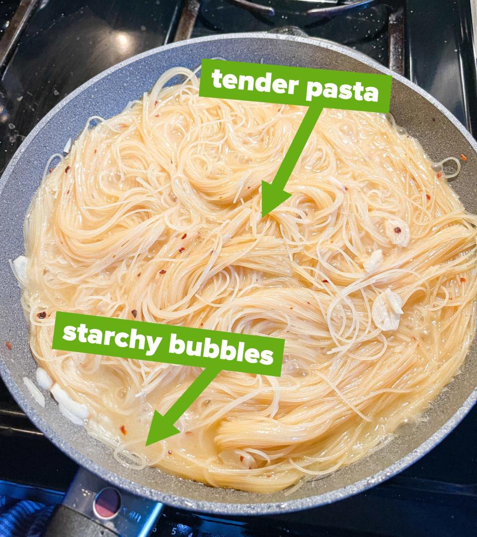 Pasta in pan with captions with arrows to "starchy bubbles" and "tender pasta"