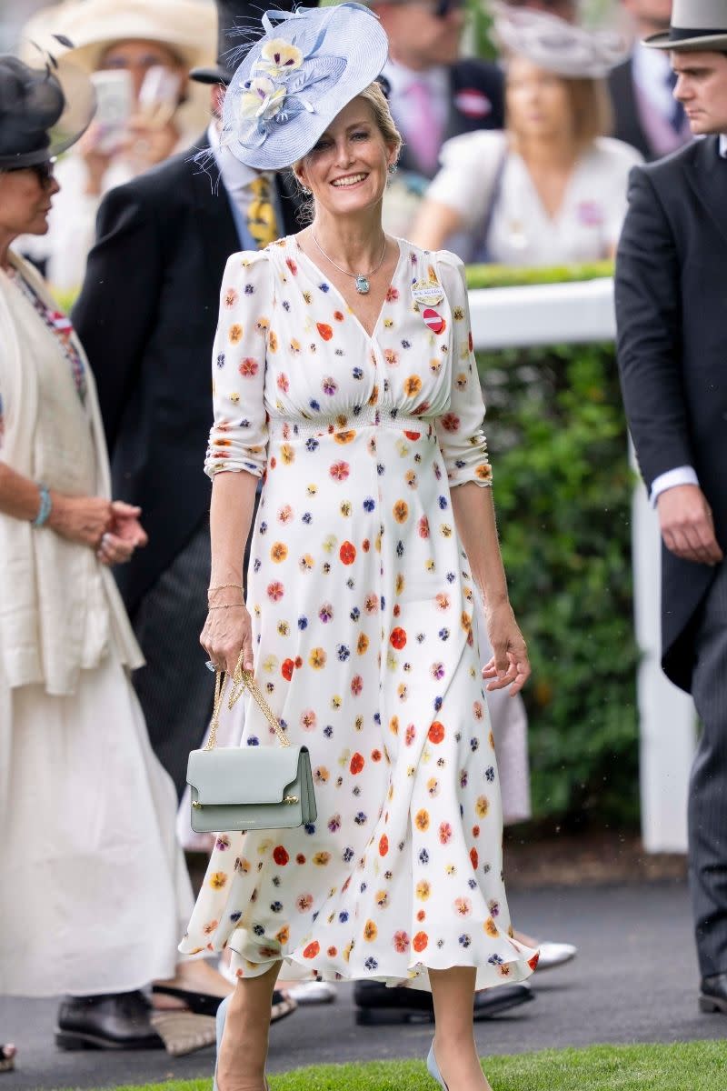 <p> We simply are in love with this maxi dress Duchess Sophie wore whilst attending the 2023 Royal Ascot. With its scattered colourful pressed-pansy pattern and ruched three-quarter sleeves, this look is a total winner in our eyes. To finish off the look, Sophie wore powder blue heels and a matching statement fascinator. </p>