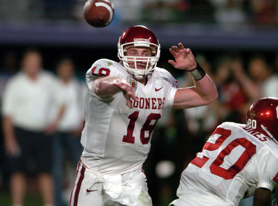 Jan. 5, 2005; Miami Gardens, Florida; Oklahoma Sooners quarterback Jason White drops back to pass during 55-19 loss to Southern California Trojans in the FedEx Orange Bowl in the BCS National Championship at Pro Player Stadium. Kirby Lee-USA TODAY Sports