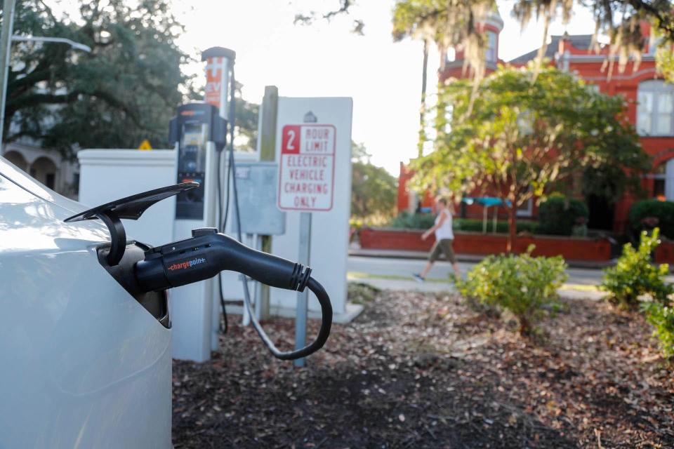 FILE: A chargepoint station offers up to 2 hours of parking a charging for electric vehicles. With federal and state funding for EV charging expanding, laws are following to ensure the nascent industry is regulated.