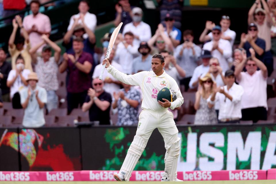 Usman Khawaja (pictured) acknowledges applauds from the spectators as he walks back to the pavilion after his century.