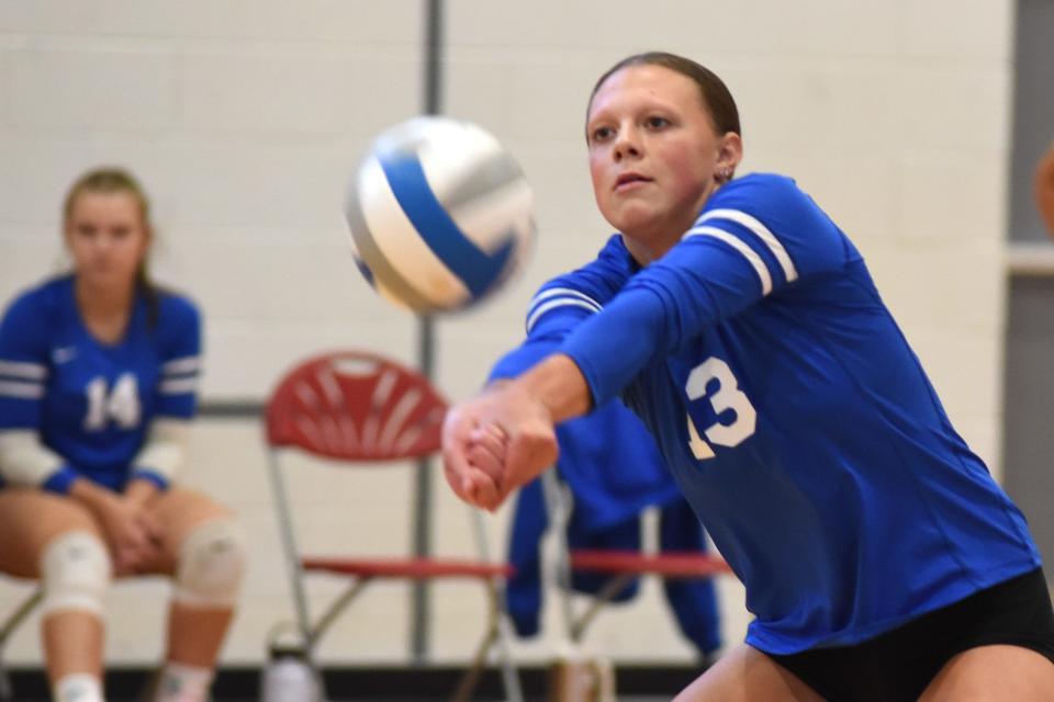 Mia Kari of Ida passes the ball against Bronson in the Bedford volleyball tournament Friday, September 1, 2023. 