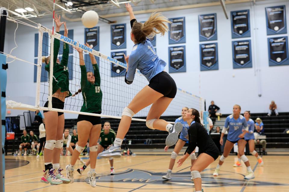 Ponte Vedra's Ava Grall (1) spikes the ball against Fleming Island.