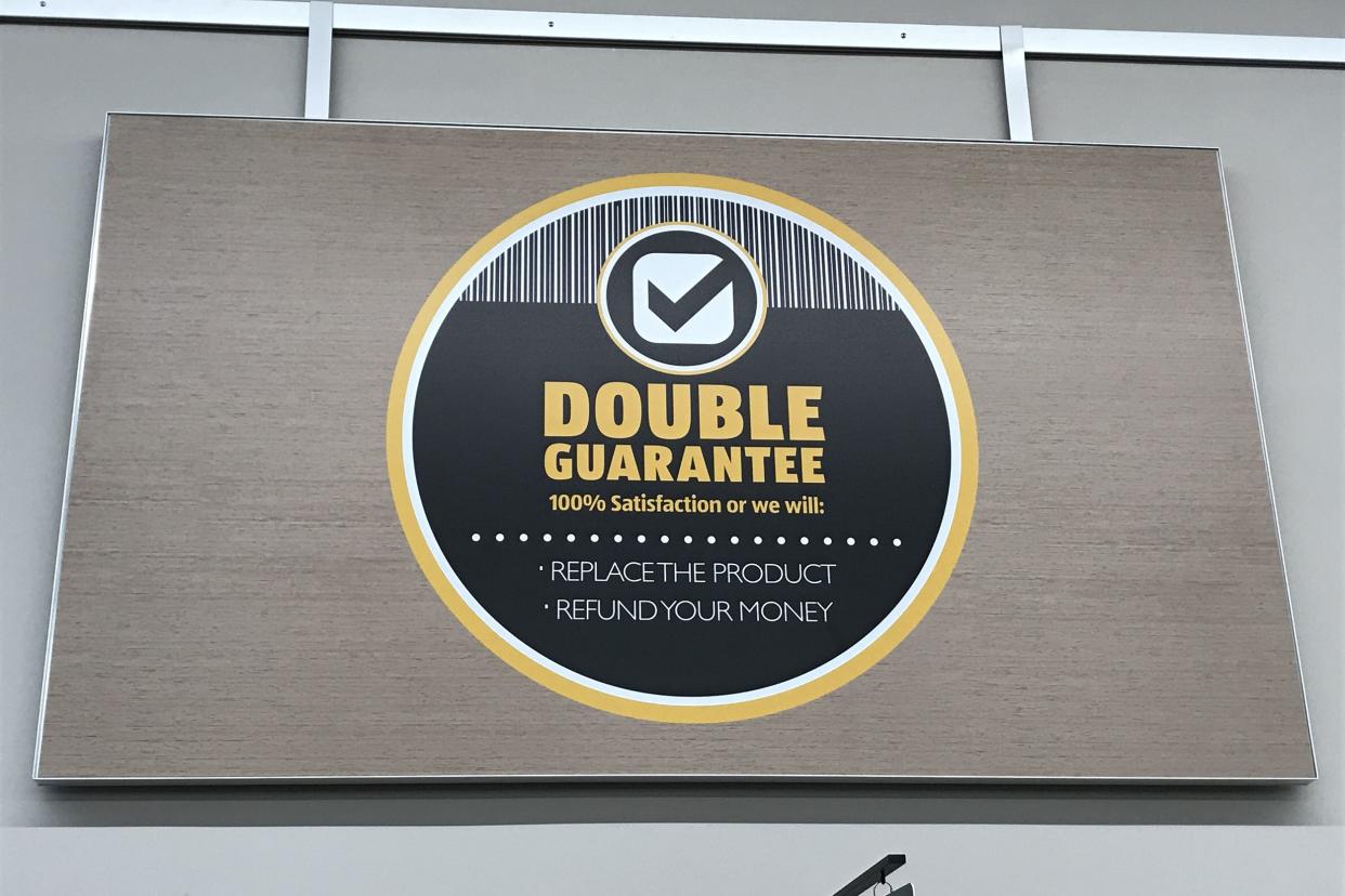 Closeup of 'Double Guarantee' sign in an Aldi store