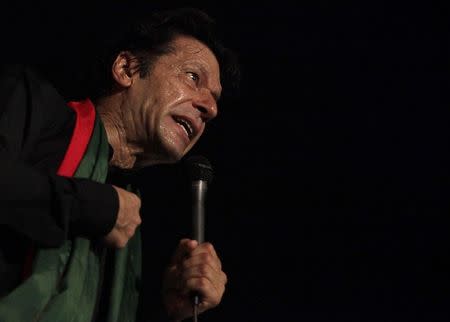 Chairman of the Pakistan Tehreek-e-Insaf (PTI) political party Imran Khan addresses his supporters during what has been dubbed a "freedom march" in Islamabad August 20, 2014. REUTERS/Faisal Mahmood