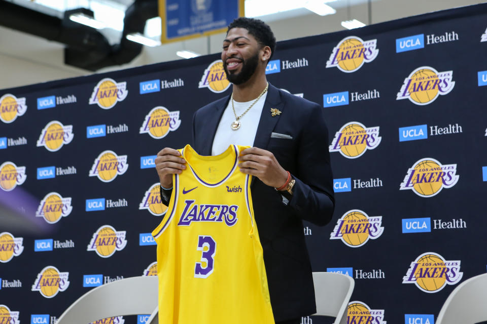 Anthony Davis showing off new #3 jersey during his presentation as a Los Angeles Laker on Saturday. (Getty)
