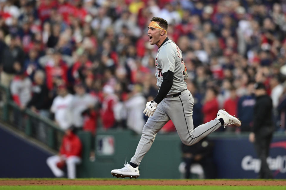 Detroit Tigers' Kerry Carpenter celebrates as he runs the bases with a three-run home run in the ninth inning during Game 2 of baseball's AL Division Series against the Cleveland Guardians, Monday, Oct. 7, 2024, in Cleveland. (AP Photo/David Dermer)