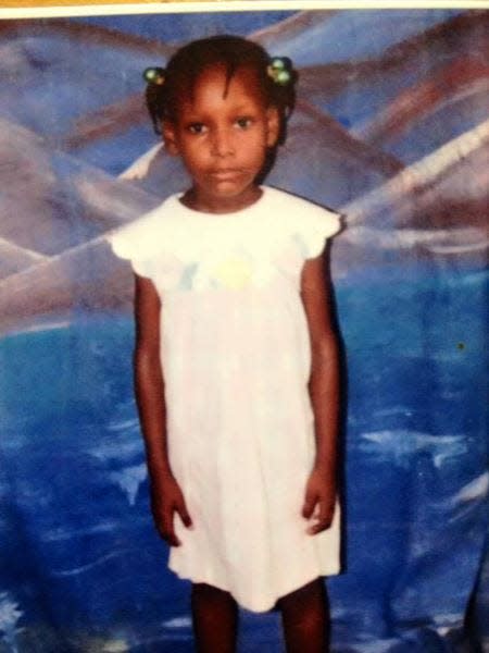 This is a picture of Jazmin Williamson in Haiti before she was adopted to an American family in 2004.