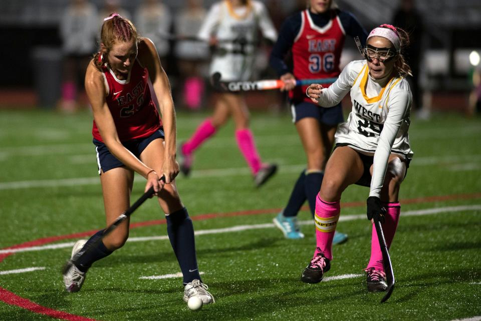 Central Bucks East's Paige Keller and Central Bucks West's Hannah Maughan fight for the ball last fall.