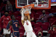 Arkansas forward Justin Smith (0) dunks in front of Auburn defender JT Thor (10) during the second half of an NCAA college basketball game Wednesday, Jan. 20, 2021, in Fayetteville, Ark. (AP Photo/Michael Woods)