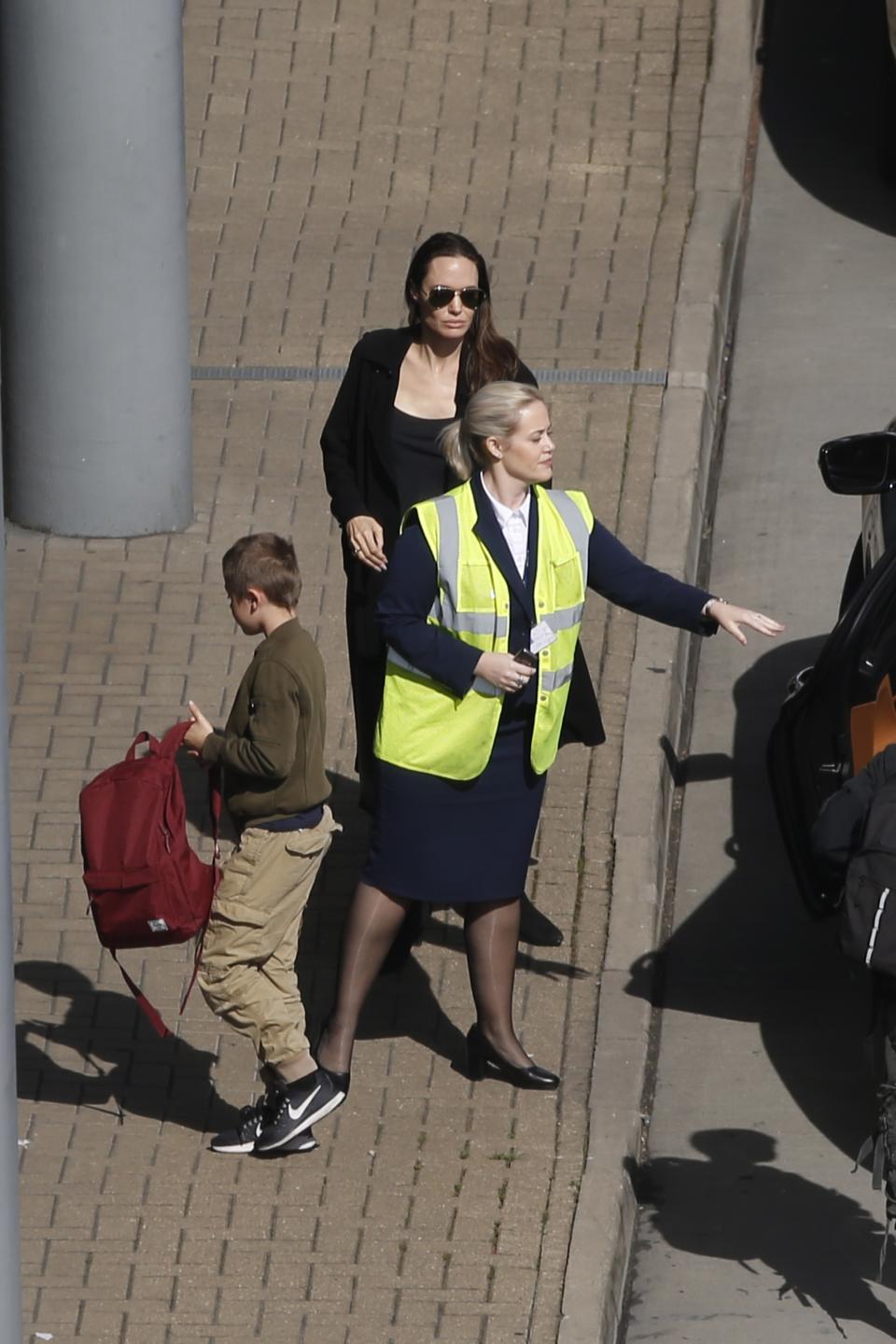 The actress was pictured at Heathrow Airport with children Shiloh, 11, and nine-year-old Knox just ahead of the royal wedding. Source: Splash