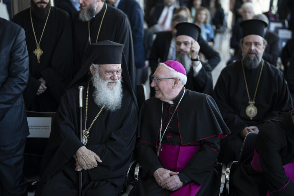 Greece's Orthodox Church Archbishop Ieronymos, left, speaks with Bishop Brian Farrell, a Vatican secretary for promoting Christian unity, during a ceremony at the Acropolis Museum for the repatriation of three sculpture fragments, in Athens, on Friday, March 24, 2023. Greece received three fragments from the ancient Parthenon temple that had been kept at Vatican museums for two centuries. Culture Ministry officials said the act provided a boost for its campaign for the return of the Parthenon Marbles from the British Museum in London. (AP Photo/Petros Giannakouris)