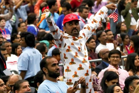 An attendee gestures during the "Howdy Modi" event in Houston