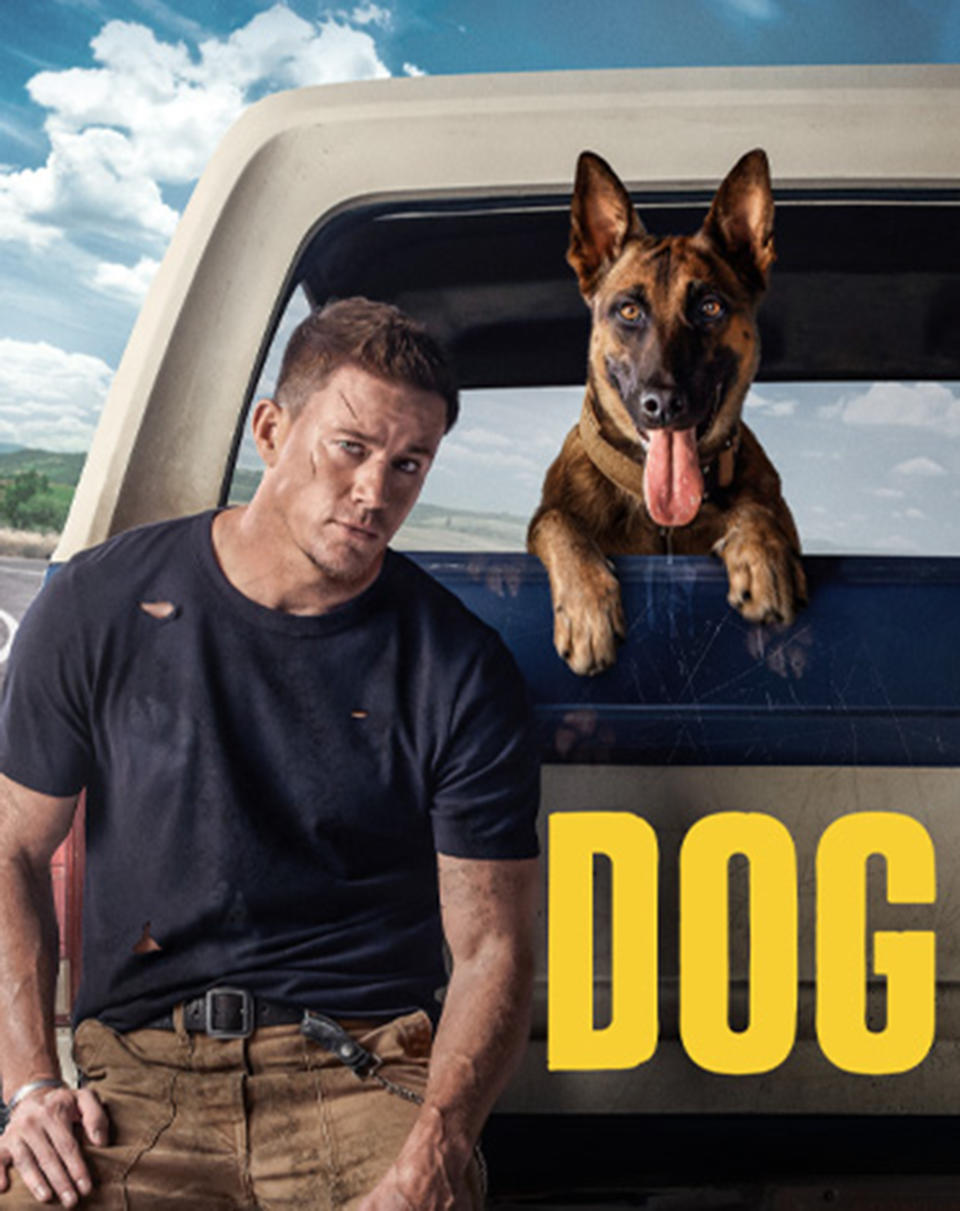 Channing Tatum leans against a pick up truck with a dog popping it's head out of the back over the ledge. (Courtesy MGM)