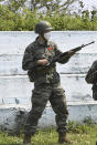 In this undated photo provided by South Korea Marine Corps' Facebook on Friday, May 8, 2020, Tottenham Hotspur forward Son Heung-min takes part in a bayonet drill at a Marine Corps boot camp in Seogwipo on Jeju Island, South Korea. Son finished his three-week military training in South Korea on Friday and was right near the top of the class.(South Korea Marine Corps' Facebook via AP)