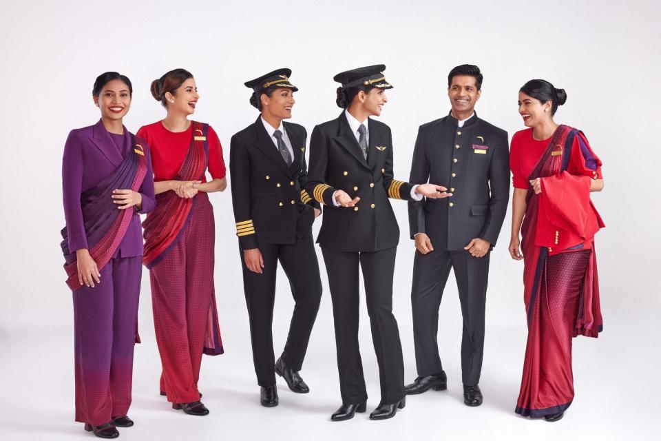Air India new cabin crew and pilot uniforms. Six people are in the photo.