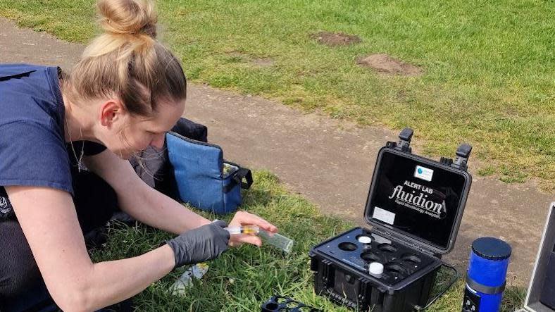 A Water Rangers volunteer testing the water at the River Wey