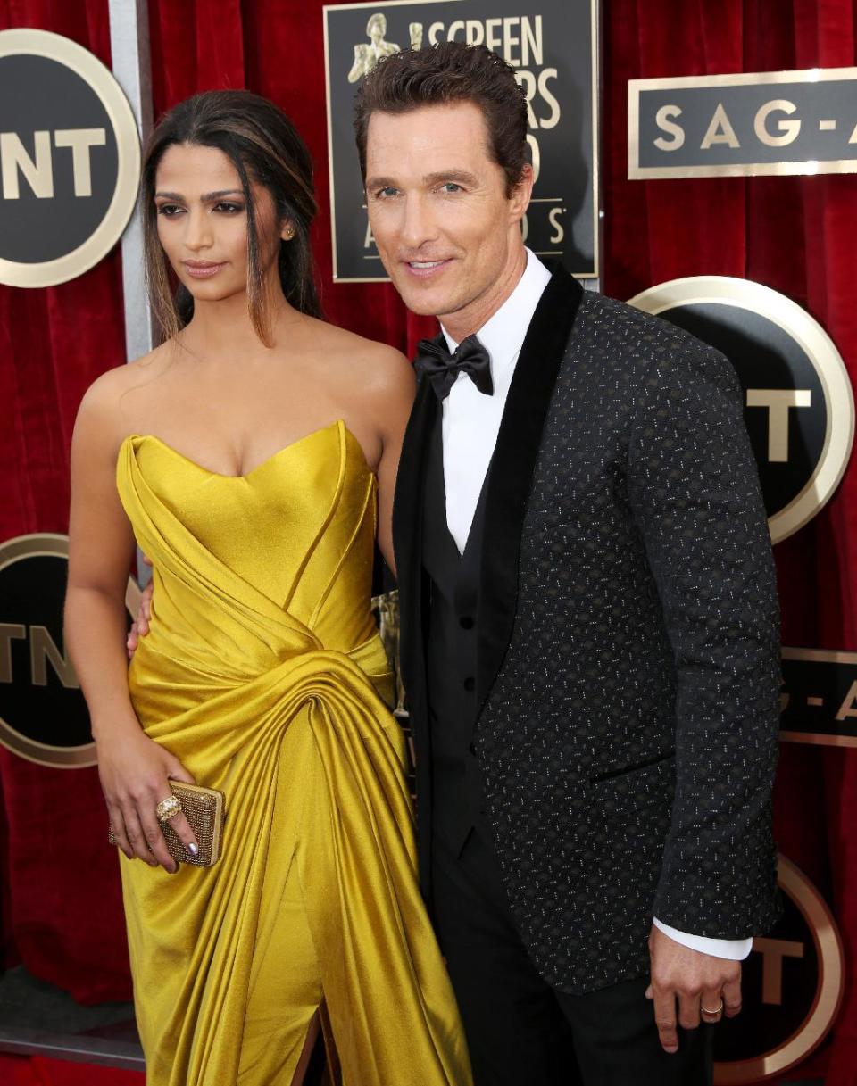 Camila Alves and Matthew McConaughey arrive at the 20th annual Screen Actors Guild Awards at the Shrine Auditorium on Saturday, Jan. 18, 2014, in Los Angeles. (Photo by Matt Sayles/Invision/AP)