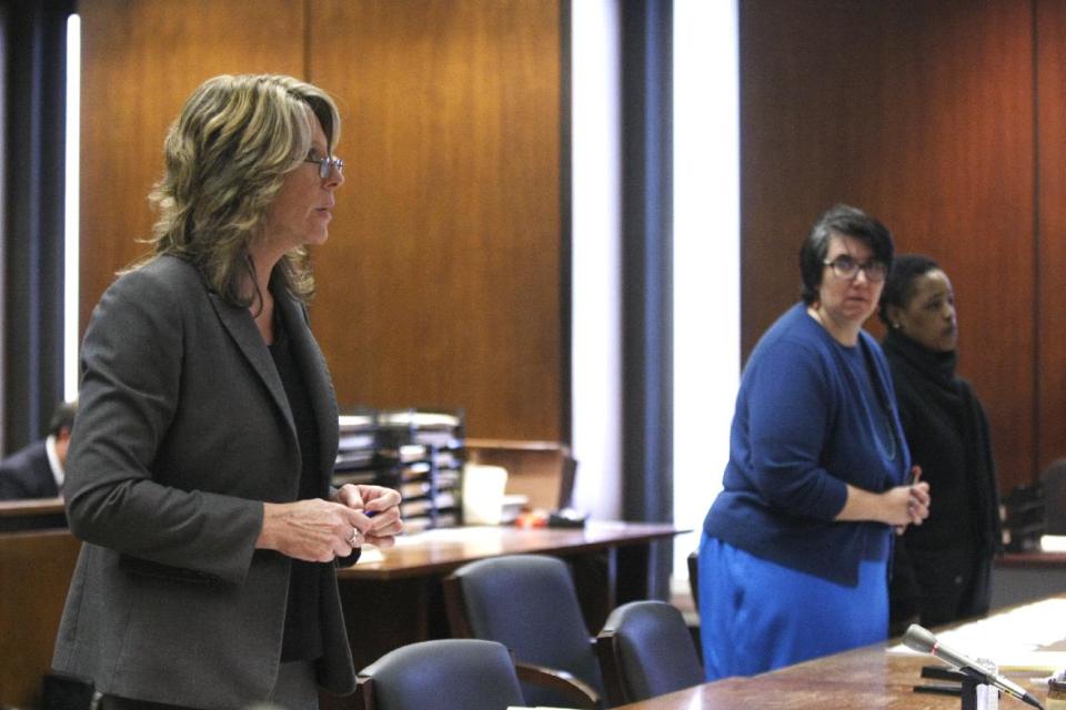 Assistant Prosecutor Michele Miller, left, addresses the court as defense attorney Susan Freedman, center, and her client Haniyyah Barnes listen, Tuesday, April 29, 2014, in Newark, N.J. The Star-Ledger of Newark reports that Barnes pleaded guilty to breaking into her neighbor's home, grabbing the 2-year-old Shih Tzu and throwing the dog into oncoming traffic in August 2011, where she was struck by a vehicle and killed. Barnes will be sentenced July 14. (AP Photo/The Star-Ledger, Patti Sapone, Pool)