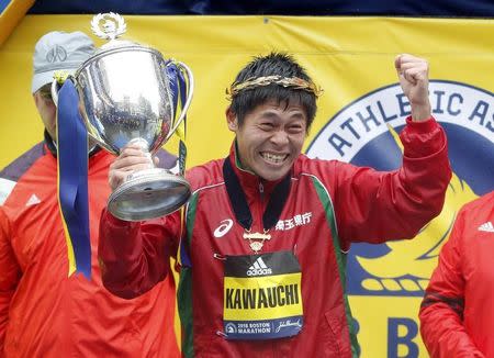 Apr 16, 2018; Boston, MA, USA; Yuki Kawauchi of Japan holds up the trophy after winning the 2018 Boston Marathon. Mandatory Credit: Winslow Townson-USA TODAY Sports