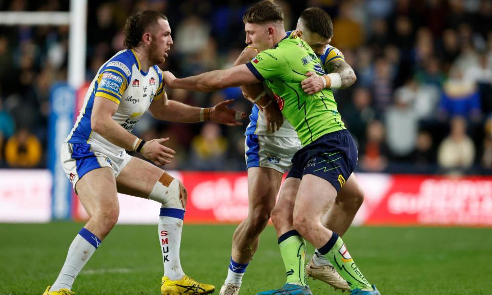 <span>The outstanding George Williams holds off Leeds defenders.</span><span>Photograph: Richard Sellers/PA</span>