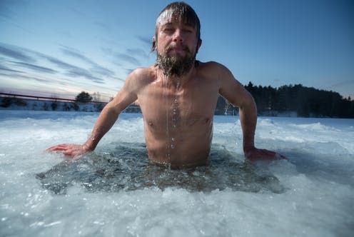 <span class="caption">People with this gene variant shivered less and had a higher core body temperature when exposed to cold water.</span> <span class="attribution"><a class="link " href="https://www.shutterstock.com/image-photo/young-man-bathing-ice-hole-237474358" rel="nofollow noopener" target="_blank" data-ylk="slk:Dudarev Mikhail/ Shutterstock;elm:context_link;itc:0;sec:content-canvas">Dudarev Mikhail/ Shutterstock</a></span>