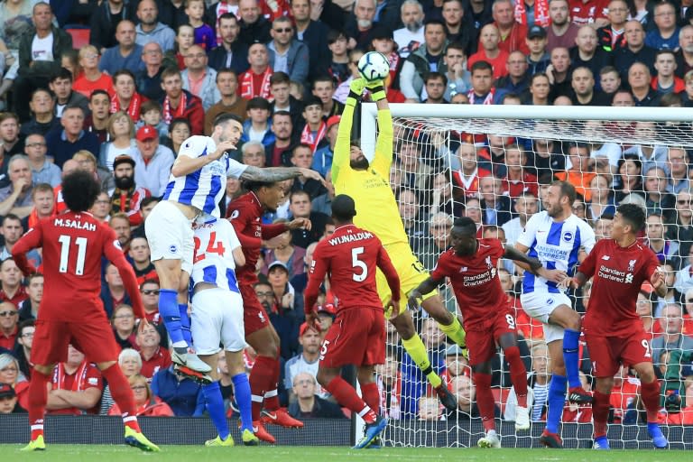 Liverpool goalkeeper Alisson claims the ball during the Premier League match against Brighton