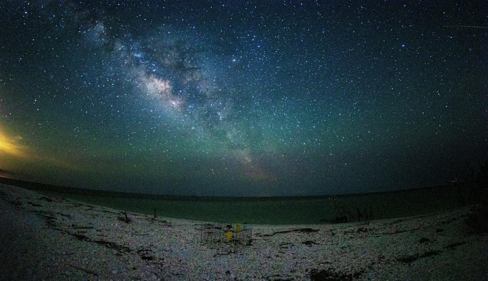 The Milky Way is seen over Cape Romano in Collier County in June of 2022. In the foreground is a turtle nest.  