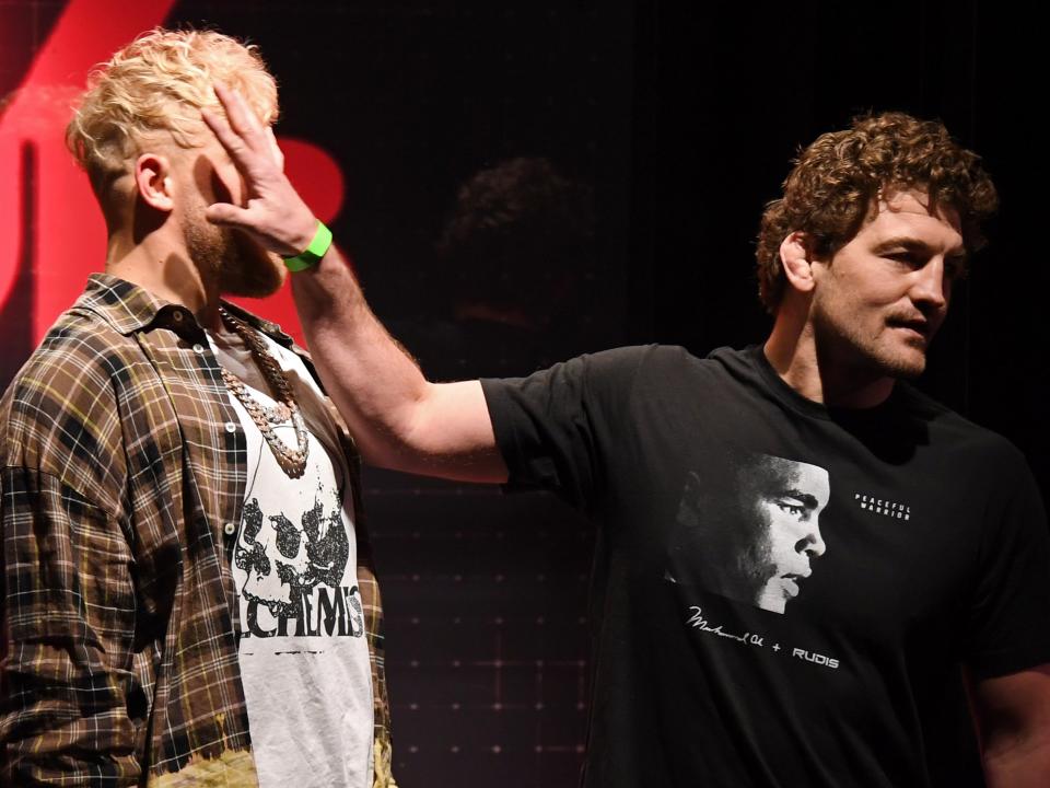 <p>Ben Askren shoves Jake Paul as they face off during a news conference</p> (Getty)