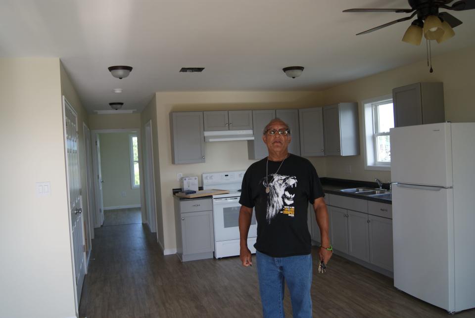 Nathan Trosclair stands Wednesday, June 1, 2022, inside the home Mennonite Disaster Service built for him and his father, John Earnest Trosclair Sr., after theirs was destroyed by Hurricane Ida.