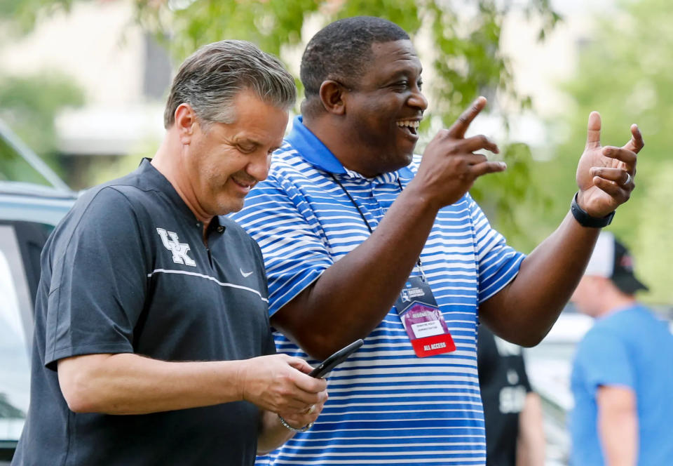 Kentucky basketball coach John Calipari and then-UK deputy director of athletics DeWayne Peevy joke around on June 5, 2017. Peevy is now DePaul's athletics director.