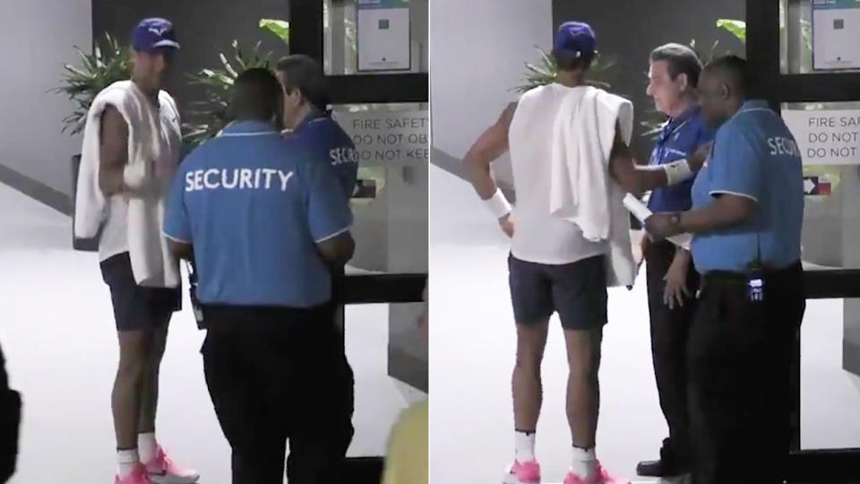 Rafael Nadal smiles as he is stopped by security at the Australian Open.