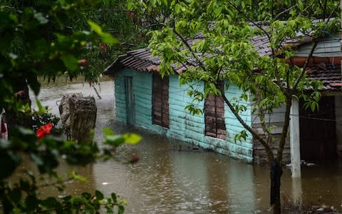 A house is flooded in the city of Santa Clara, Cuba, after heavy rains associated with subtropical storm Alberto - Credit: AFP