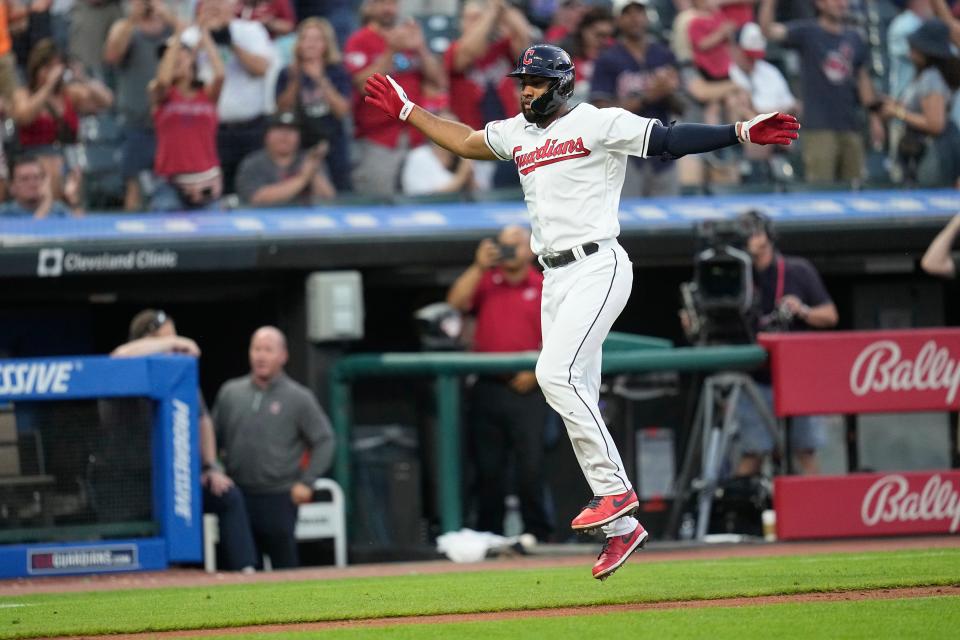 Cleveland Guardians' Amed Rosario jumps as he runs toward home plate on a home run against the Atlanta Braves during the sixth inning of a baseball game Tuesday, July 4, 2023, in Cleveland. (AP Photo/Sue Ogrocki)