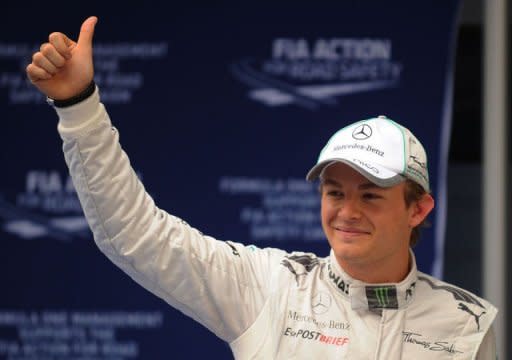 Mercedes-AMG driver Nico Rosberg of Germany gives a thumbs after after qualifying on pole for Formula One's Chinese Grand Prix at the Shanghai International Circuit